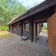 DieMaacklerOHG - Haus im Grünen: Blockhaus mit großem Garten und sanierungsbedürftigem Altbestand