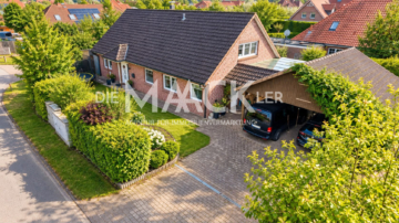 Viel Platz für die Familie – gepflegtes Haus mit Kamin, Terrassen und großem Doppelcarport - DieMaacklerOHG (27306)